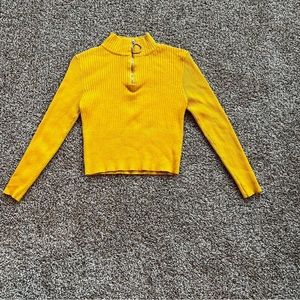 Yellow cropped sweater.